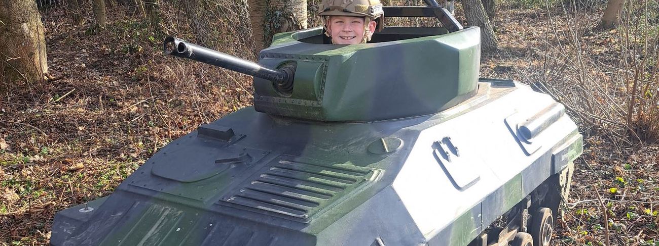 Drivers in helmets ready for a tank session